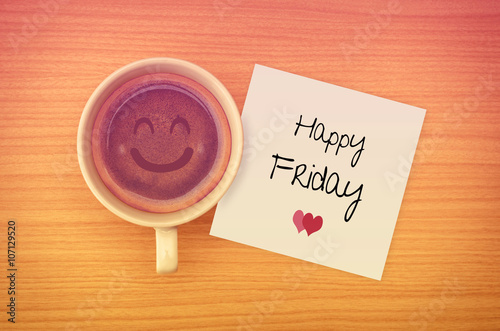 Fotografia Happy Friday on paper note with coffee cup,top view.