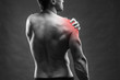 © staras - Pain in the shoulder. Muscular male body. Handsome bodybuilder posing on gray background