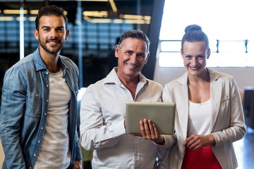 Aufkleber - Businessmen and businesswoman holding digital tablet