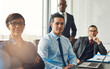 © Flamingo Images - Smiling confident business team seated at a table