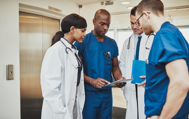 Wall Mural - Black surgeon giving instruction to medical team