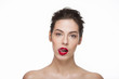 Image of a beautiful girl with red lipstick lick her lips over white background. Isolated