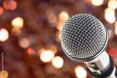 Fotografija close up microphone on night bokeh background abstract