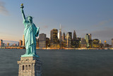 Fototapeta Nowy Jork - Manhattah skyline at night and Statue of Liberty.
