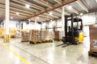 Large modern warehouse with forklifts