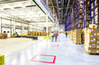 Blurred man inspecting boxes in distribution warehouse