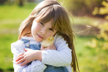 Young Beautiful Girl, Playing With Little Newborn Chick In The P