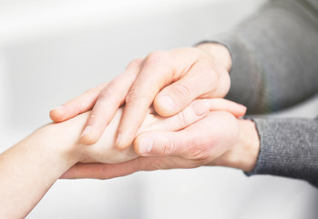 Canvas Print - Man and woman holding hands closeup