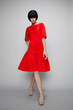 © EVGENY FREEONE - Brunette woman in red dress