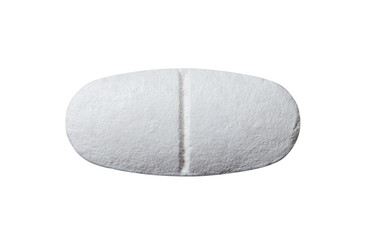 Close-up white pill on isolated background.