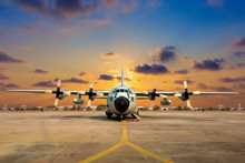 Military Aircraft On The Runway During Sunset.