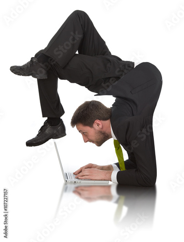 Fotografie, Obraz businessman work contortion with laptop isolated on white