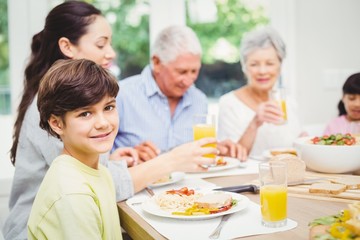 Wall Mural - Portrait of smiling boy with family 