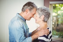 Romantic Senior Husband Embracing Wife