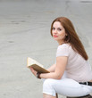 A young woman and a book