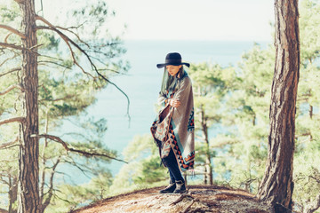 Poster - Fashionable girl walking on coast