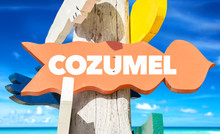 Cozumel Signpost With Beach Background