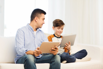 Poster - happy father and son with tablet pc at home