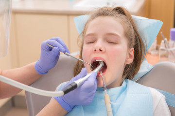 Wall Mural - Young girl at dentist., dental treatment

