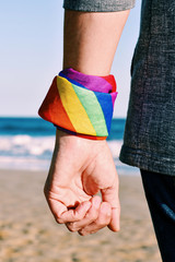 Canvas Print - man with a rainbow-patterned kerchief in his wrist