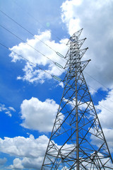 High-voltage towers under blue sky.