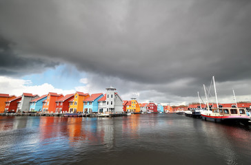 Fototapete - colorful buildings on water in haven