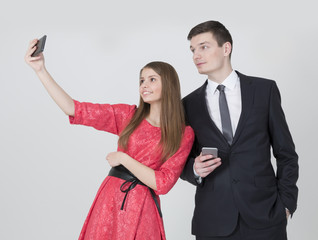 Brother and sister taking selfie 