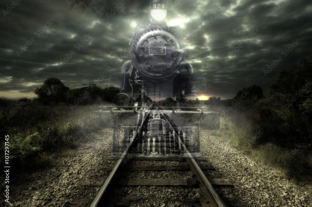 Scene of an old steam locomotive appearing ghostly on railway tracks ...