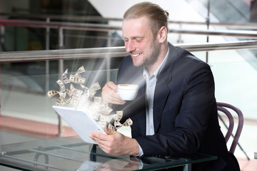 Sticker - Financial concept. Make money on the Internet. Young attractive businessman having lunch and working in a cafe