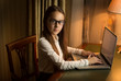 © Kyrylo Ryzhov - Brunette schoolgirl posing in cabinet with laptop