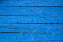 Old Blue Cracked Paint On The Old Wooden Background