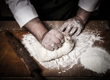Fototapeta  - The process of making home bread by male hands. Toned