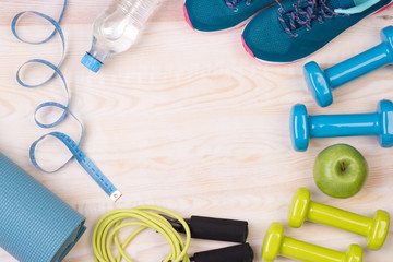 Wall Mural - Fitness equipment on wooden background with copy space