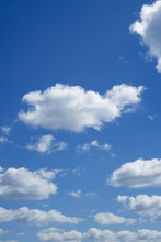 White Heap Clouds In The Blue Sky. Cloudscape Over Horizon.