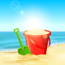 Bucket Of Sand And Shovel On Beach