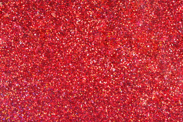 Wall Mural - red glitter texture close-up as a background.