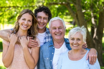 Smiling family hugging