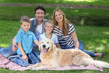 Wall Mural - Family with dog in the park