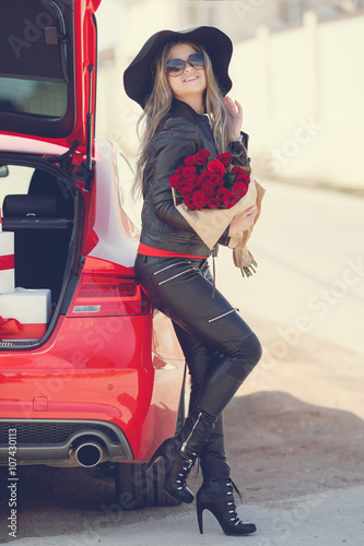 The Young Woman The Blonde With A Thick Long Hair In Sun Glasses