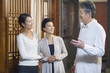 © Blue Jean Images - Senior Chinese doctor talking with patient