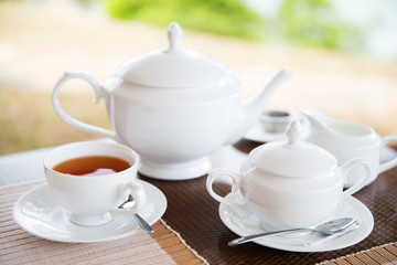 Wall Mural - close up of tea service at restaurant or teahouse