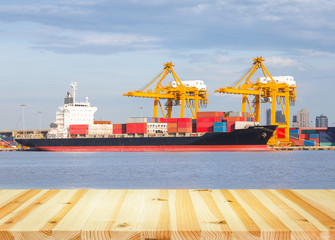 Gantry crane loading and unloading cargo container  from cargo ship at port to show global international logistics and transportation by cargo ship and cargo container, Logistic import export concept.