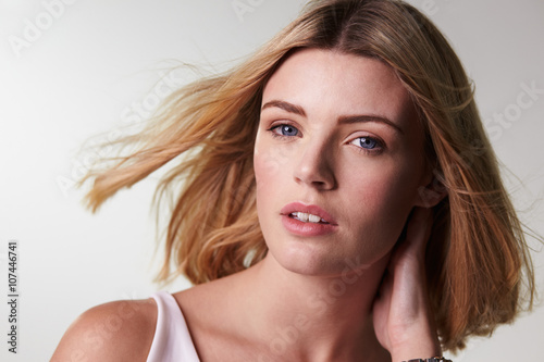 Blonde Woman Looking At Camera Hair Blowing Horizontal Buy