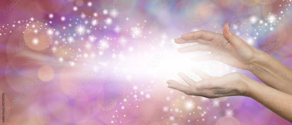 The Magic of Healing - female parallel hands with a burst of white light between and outwardly flowing sparkles on a pink purple background with plenty of copy space - obrazy, fototapety, plakaty 