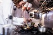 © WavebreakmediaMicro - Group of chef preparing food in the kitchen