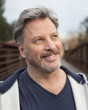 © Sam Diephuis/Blend Images - Close up of smiling face of Caucasian man