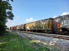 Industrial Urban Railroad Train Cars With Painted Graffiti - Landscape Color Photo