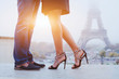 romantic holidays in Paris, feet of couple kissing near Eiffel tower