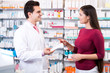 © JackF - Experienced pharmacist counseling female customer