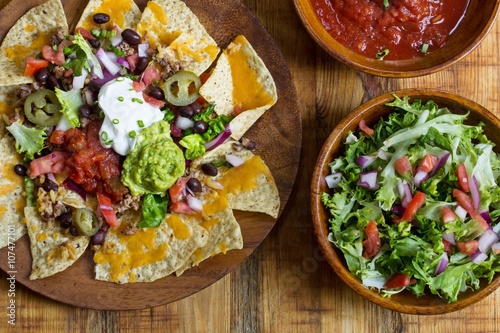 Fényképezés Nacho Cheese Tortilla chips with chili and salsa